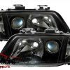 Audi A6 - lampy przód 97-01 ciemne soczewkowe NC